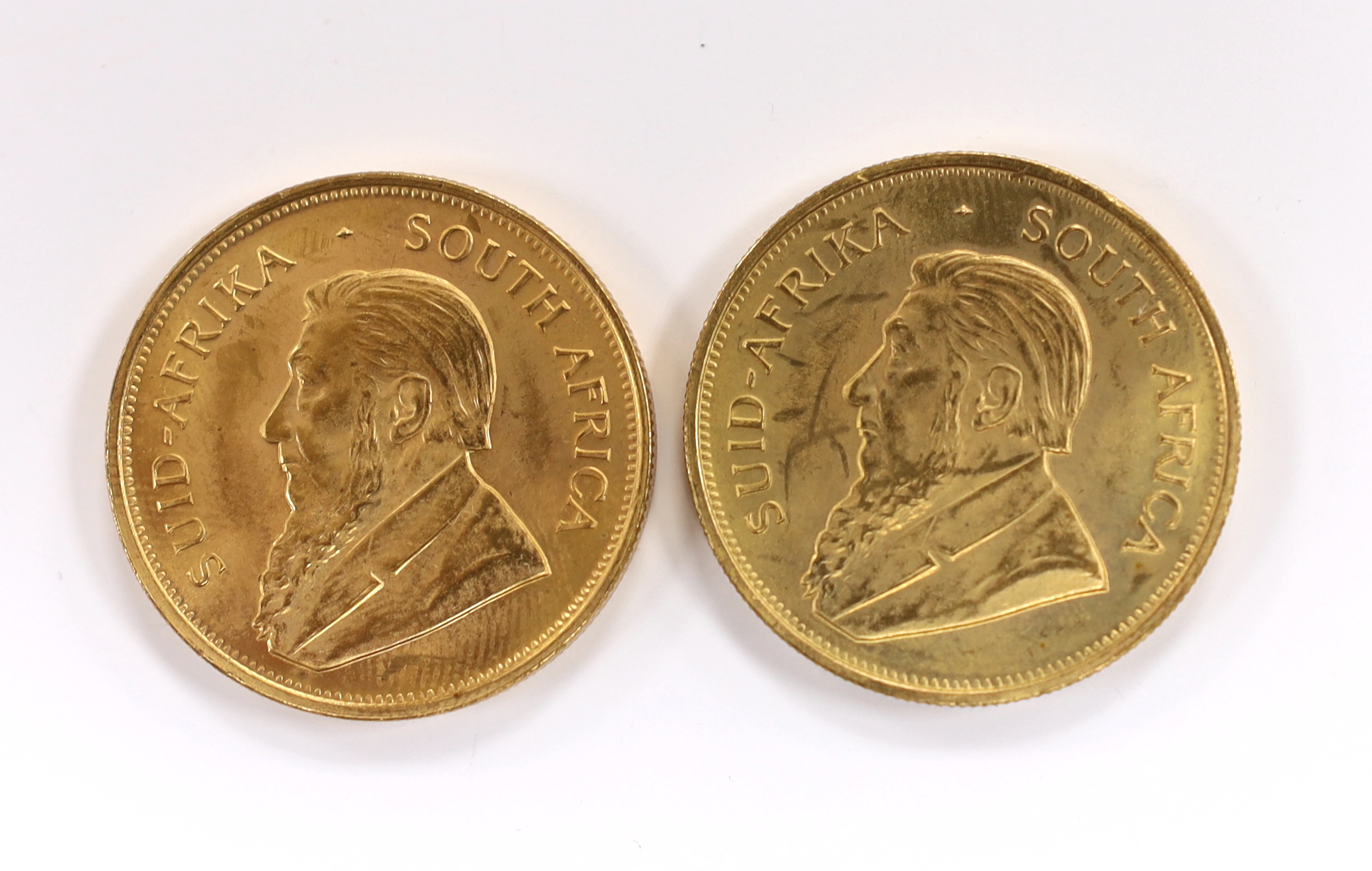 Gold coins, South Africa, two gold 1oz. Krugerrands, 1975, near UNC (2oz.)